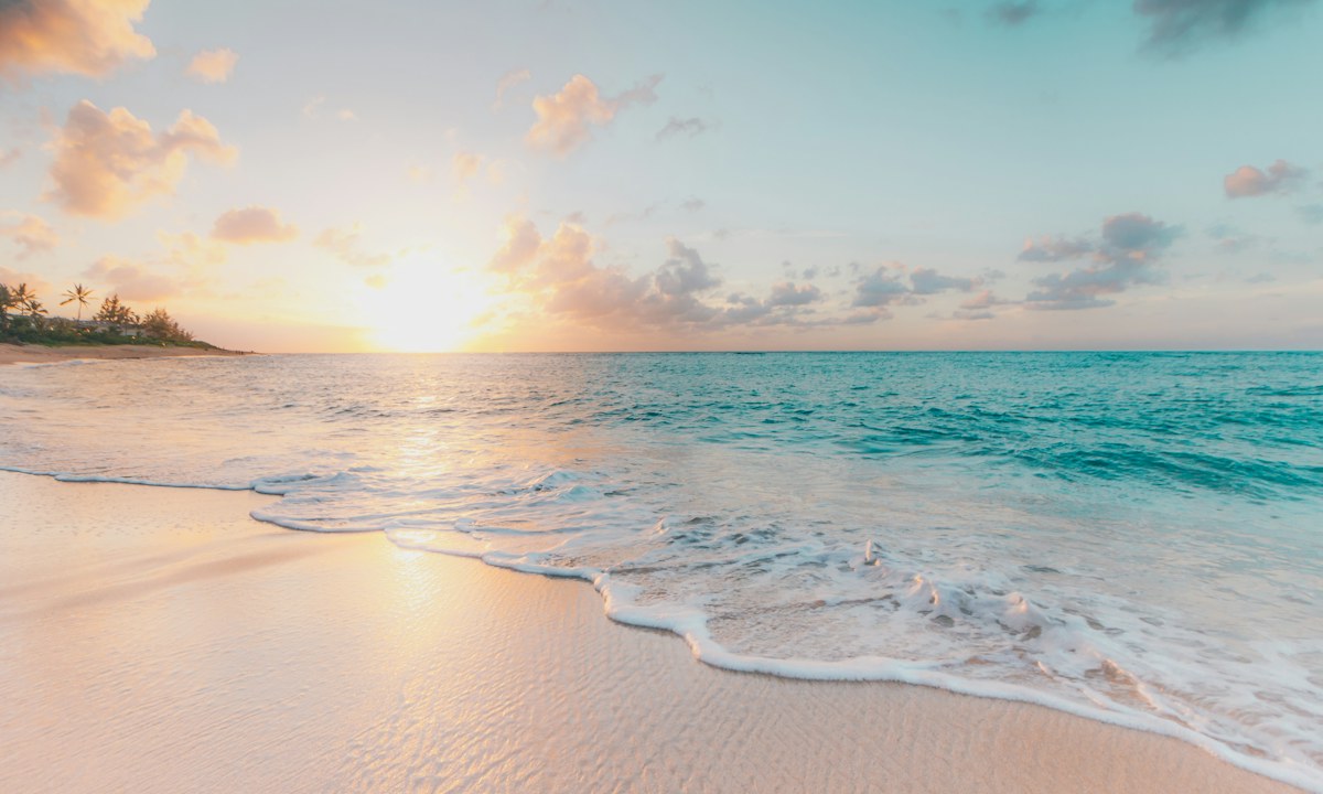 Tropical coastline with turquoise water and pale sand