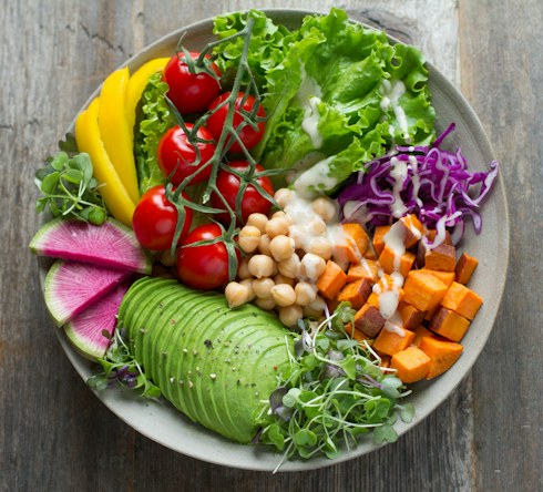 Colorful salad with avocado and fresh vegetables